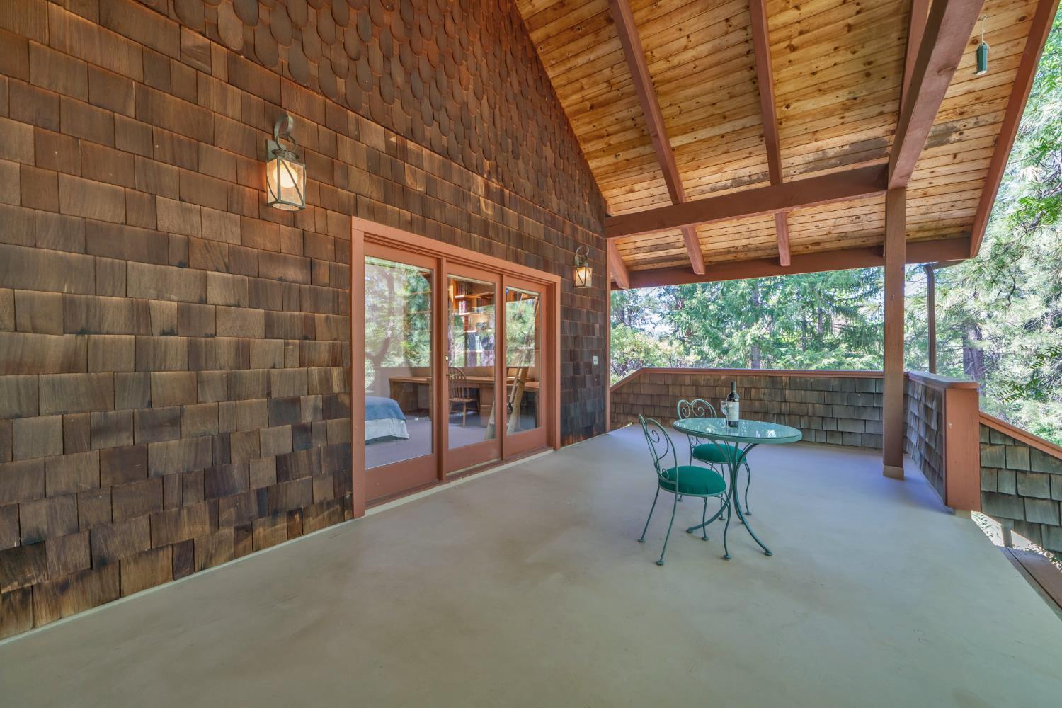 2399 Kingsgate Road Placerville, CA 95667 - Photo 49 of 89 a view of a porch with chairs and backyard