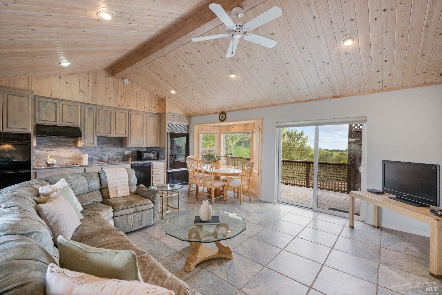 127 Mountain Meadow Lane Santa Rosa, CA 95404 - Photo 18 of 24 a living room with fireplace furniture and a flat screen tv