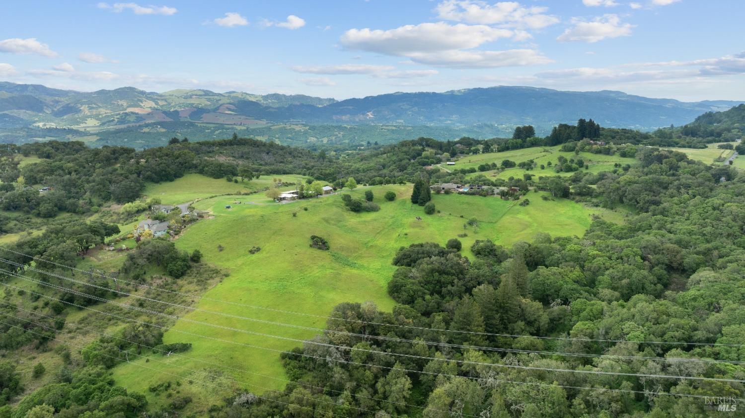 127 Mountain Meadow Lane Santa Rosa, CA 95404 - Photo 23 of 24 a view of a lush green hillside and houses