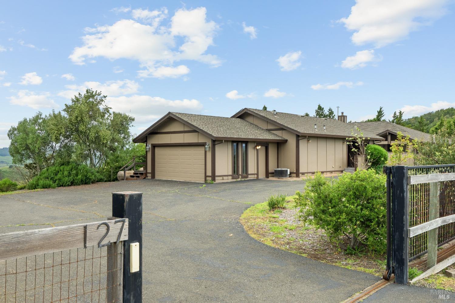127 Mountain Meadow Lane Santa Rosa, CA 95404 - Photo 3 of 24 a view of house with a yard and potted plants