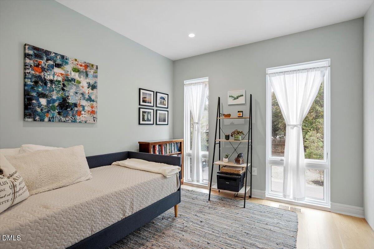 206 Dundas Lane Raleigh, NC 27603 - Photo 21 of 30 a bedroom with a large bed and a window