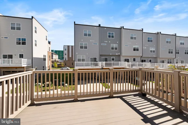 a view of a balcony with a barbeque