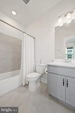 a bathroom with a toilet a sink and a bathtub
