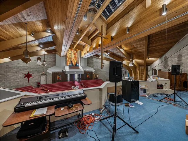 a room with a bed and a television