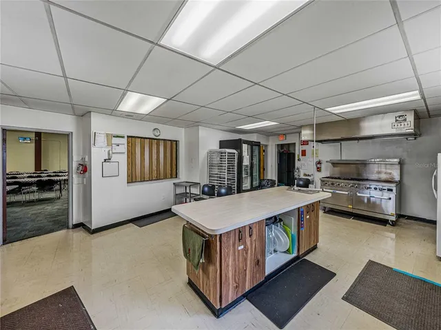 a living room with lots of furniture and a book shelf