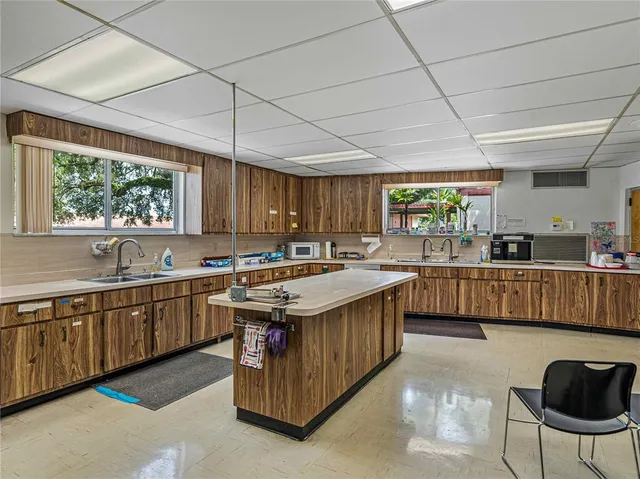 a outdoor space with lots of furniture and mirrors