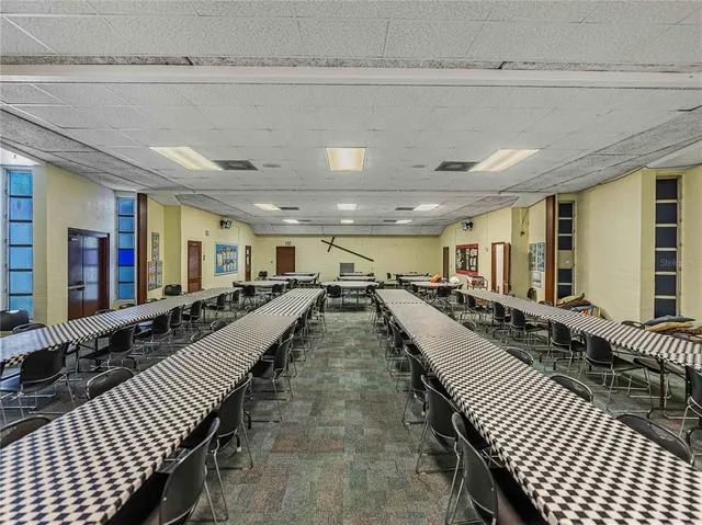 a view of a hallway with wooden cabinets