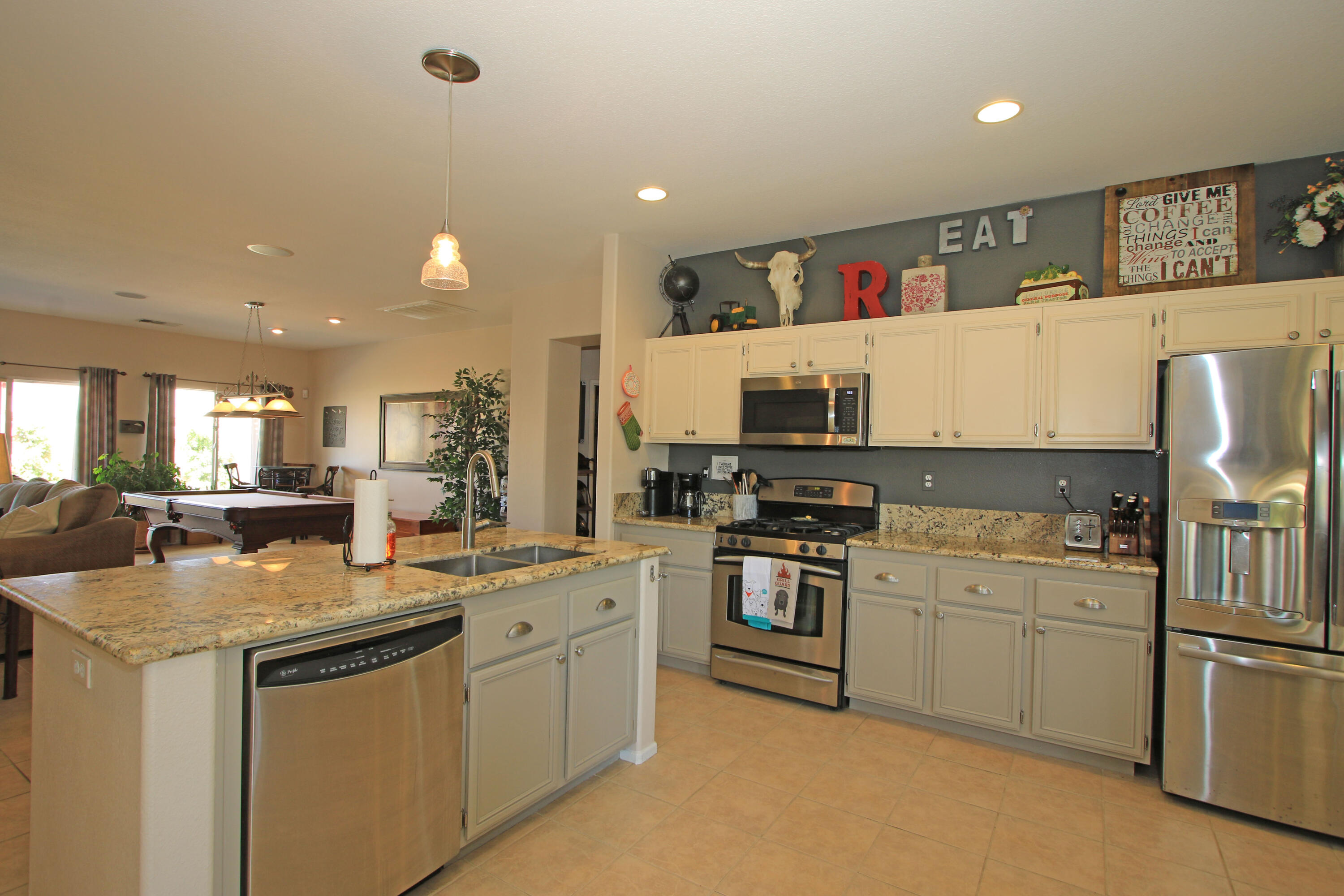 40651 Morris Street Indio, CA 92203 - Photo 13 of 47 a kitchen with white cabinets sink and white appliances