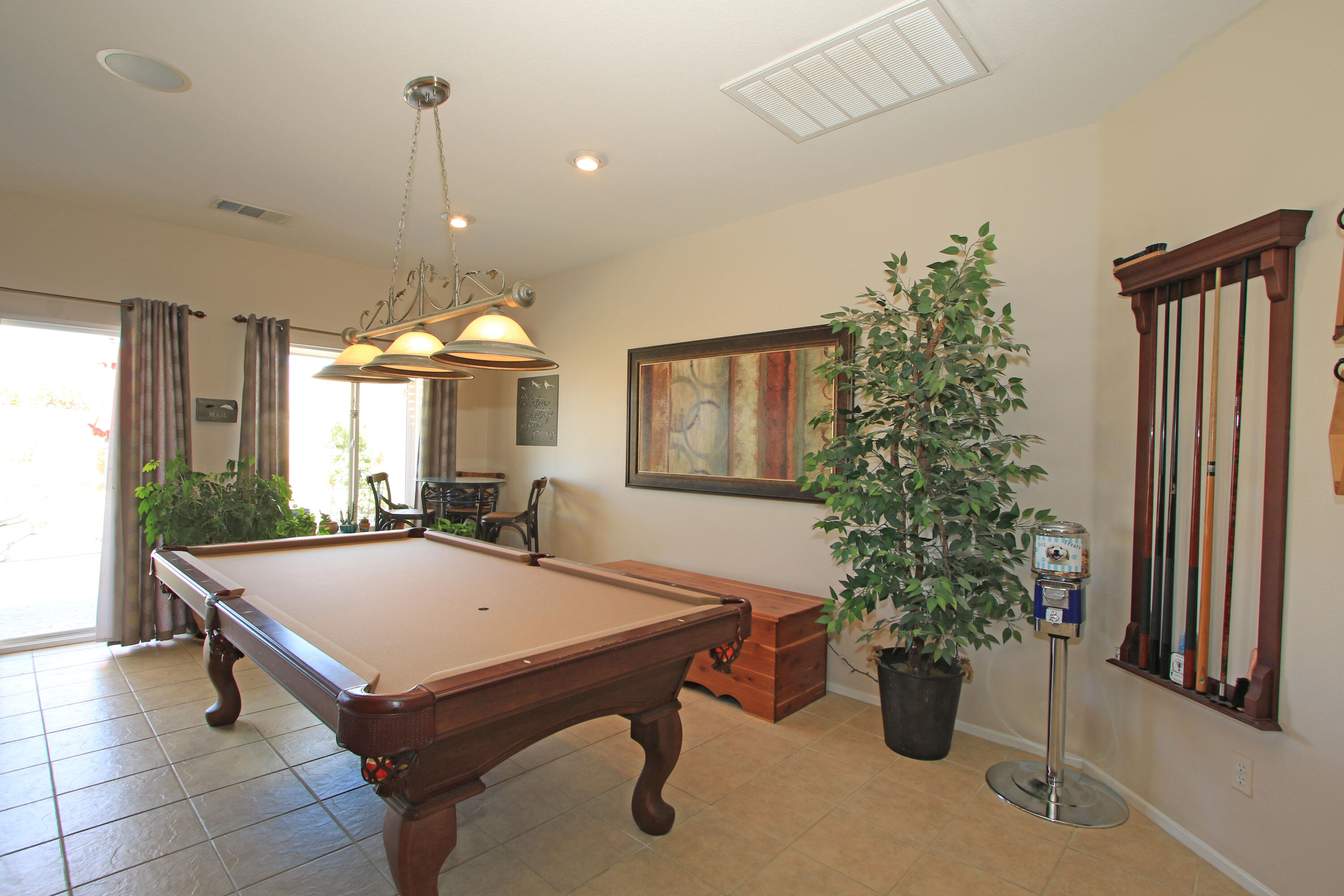 40651 Morris Street Indio, CA 92203 - Photo 16 of 47 a living room with furniture and a potted plant