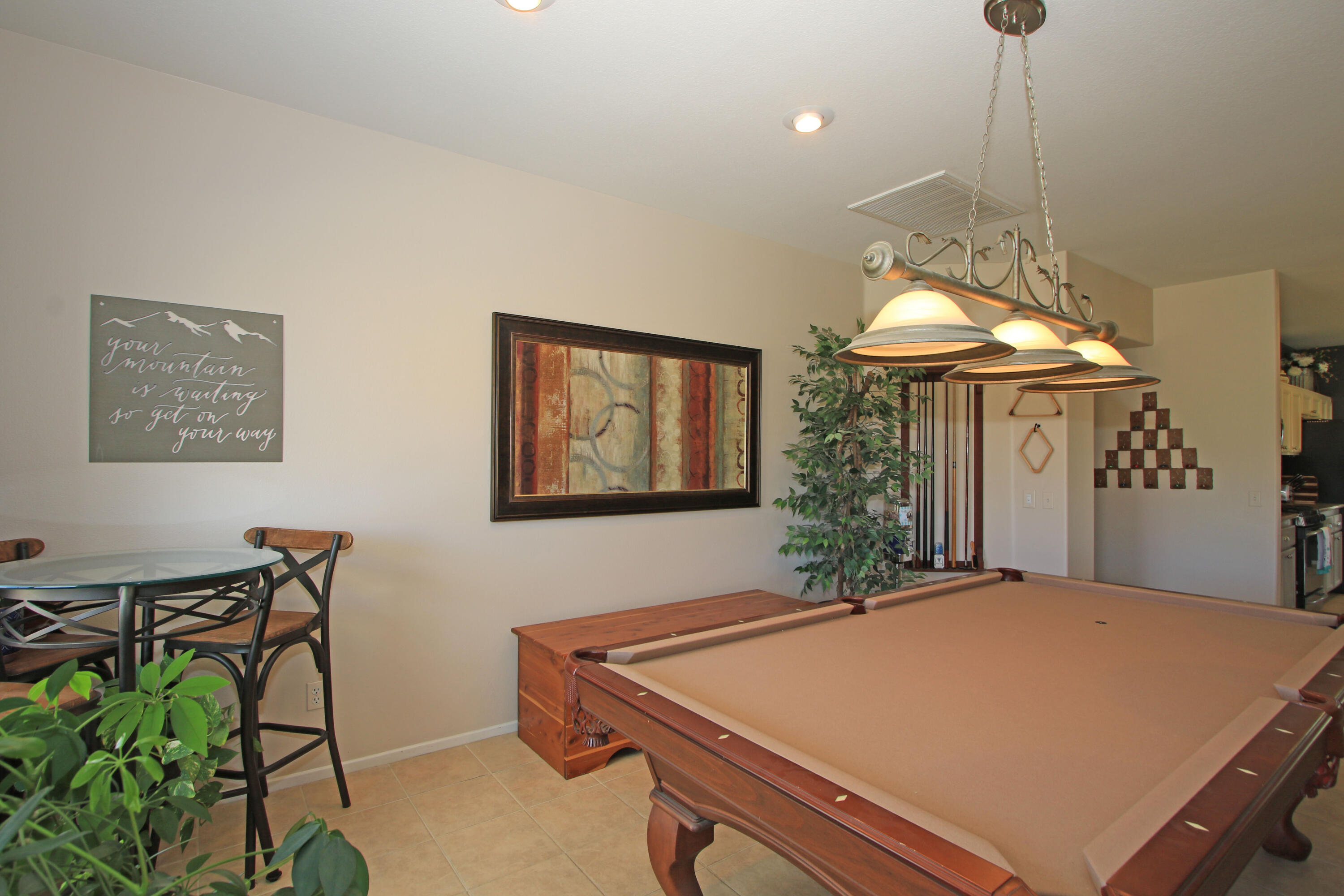 40651 Morris Street Indio, CA 92203 - Photo 17 of 47 a bedroom with a bed and a chandelier