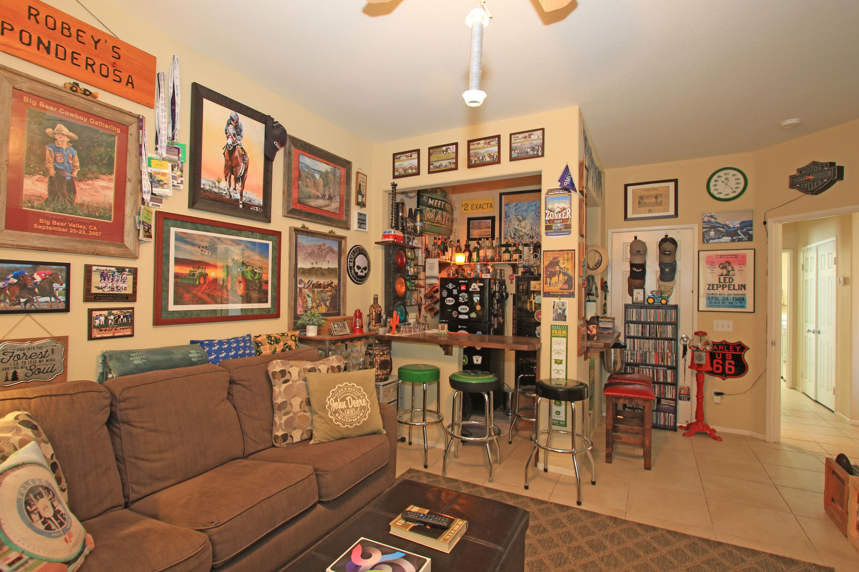 40651 Morris Street Indio, CA 92203 - Photo 21 of 47 a living room with furniture a chandelier and kitchen view