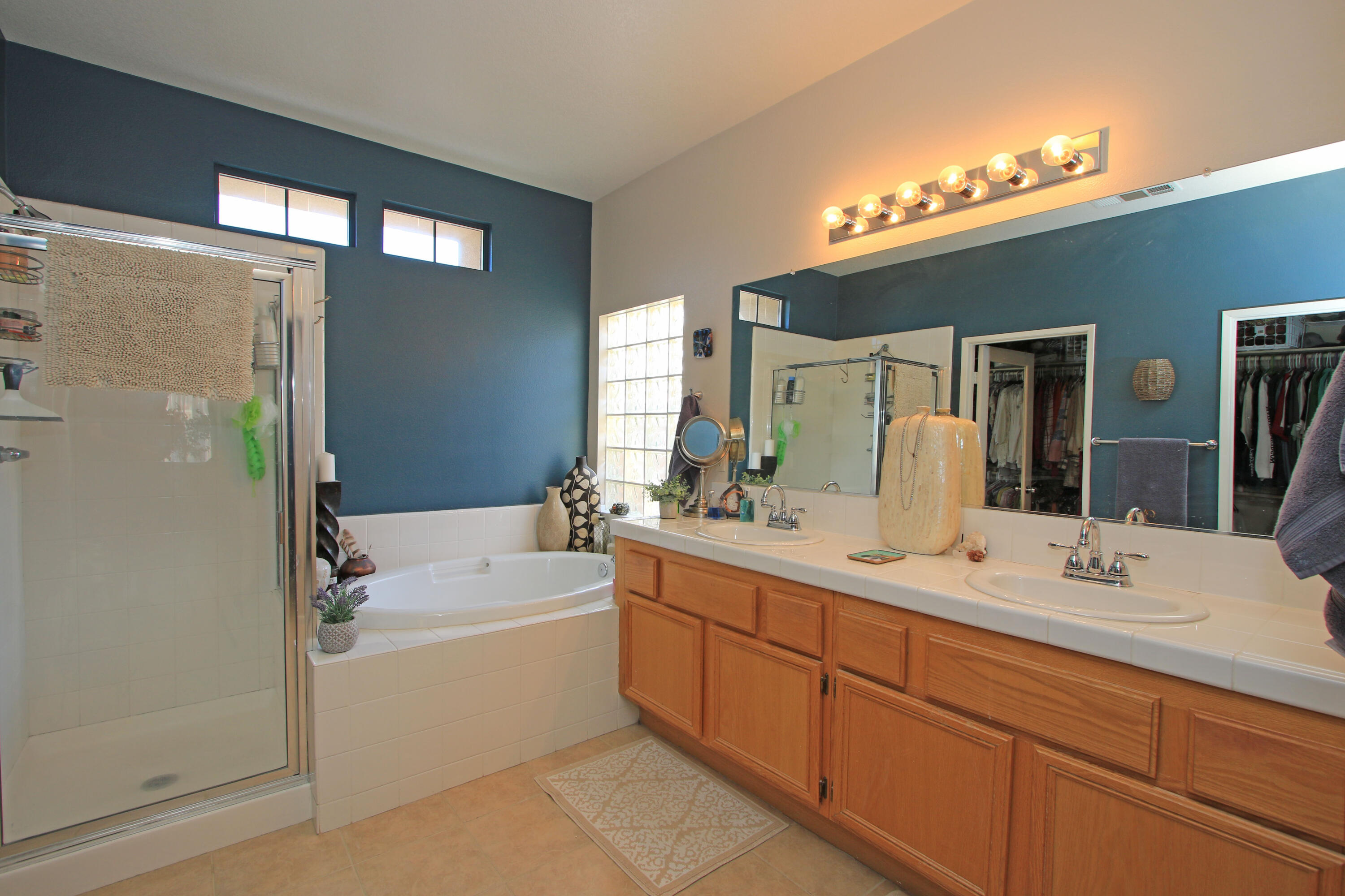 40651 Morris Street Indio, CA 92203 - Photo 24 of 47 a bathroom with a double vanity sink mirror and bathtub