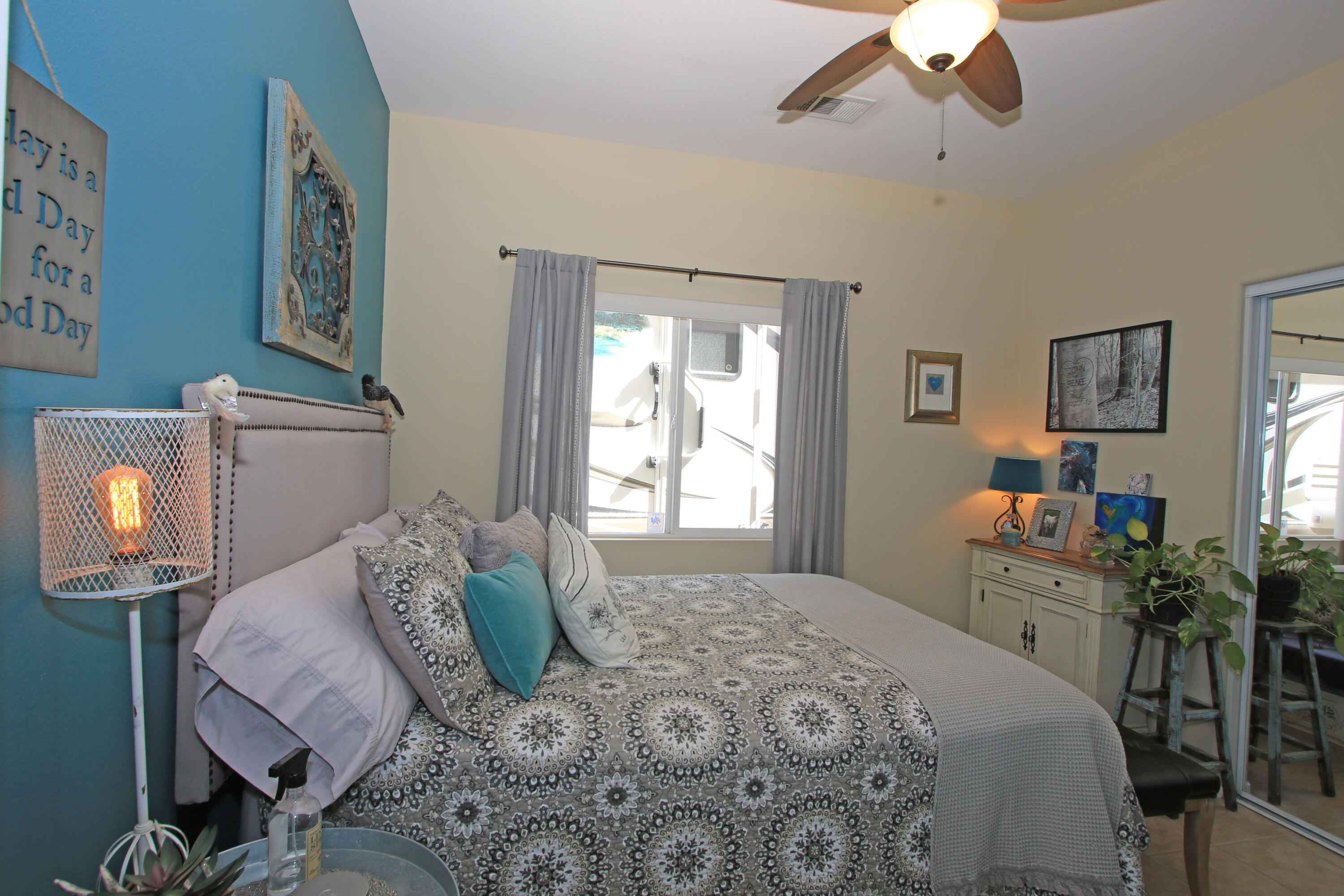 40651 Morris Street Indio, CA 92203 - Photo 25 of 47 a bedroom with a bed and wooden floor