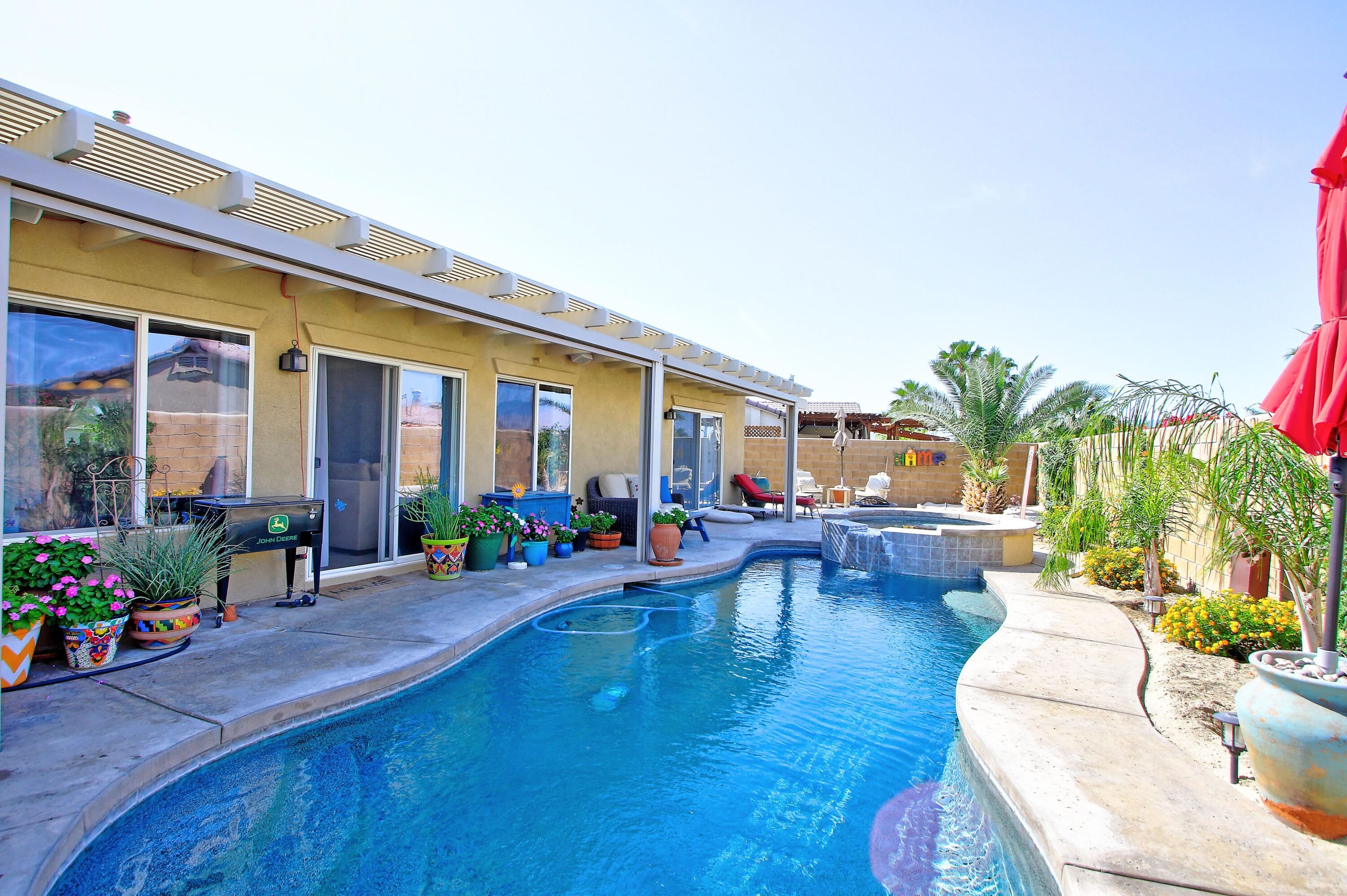 40651 Morris Street Indio, CA 92203 - Photo 30 of 47 a living room with furniture and a potted plant