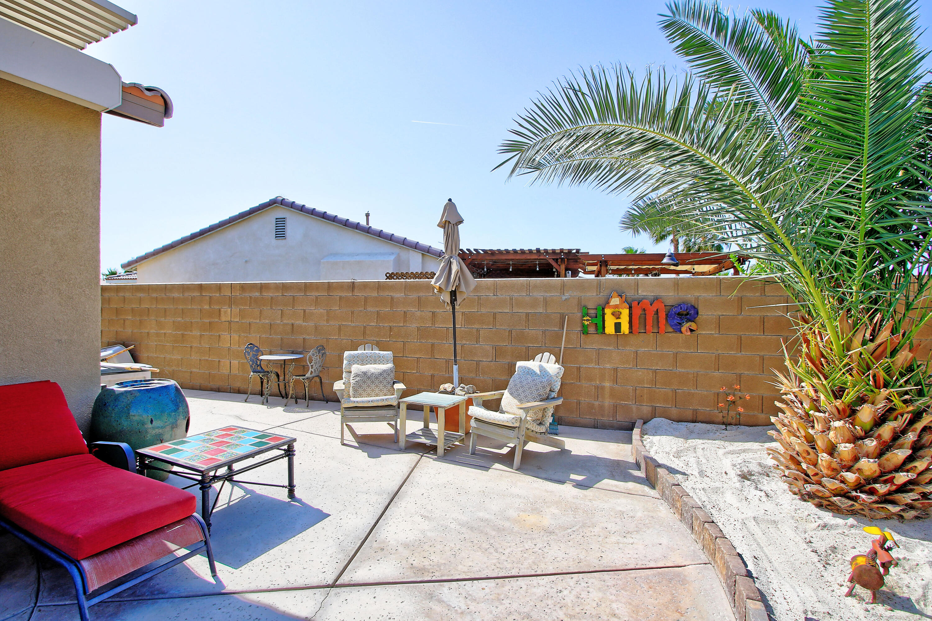40651 Morris Street Indio, CA 92203 - Photo 36 of 47 a outdoor space with the couches and a potted plant