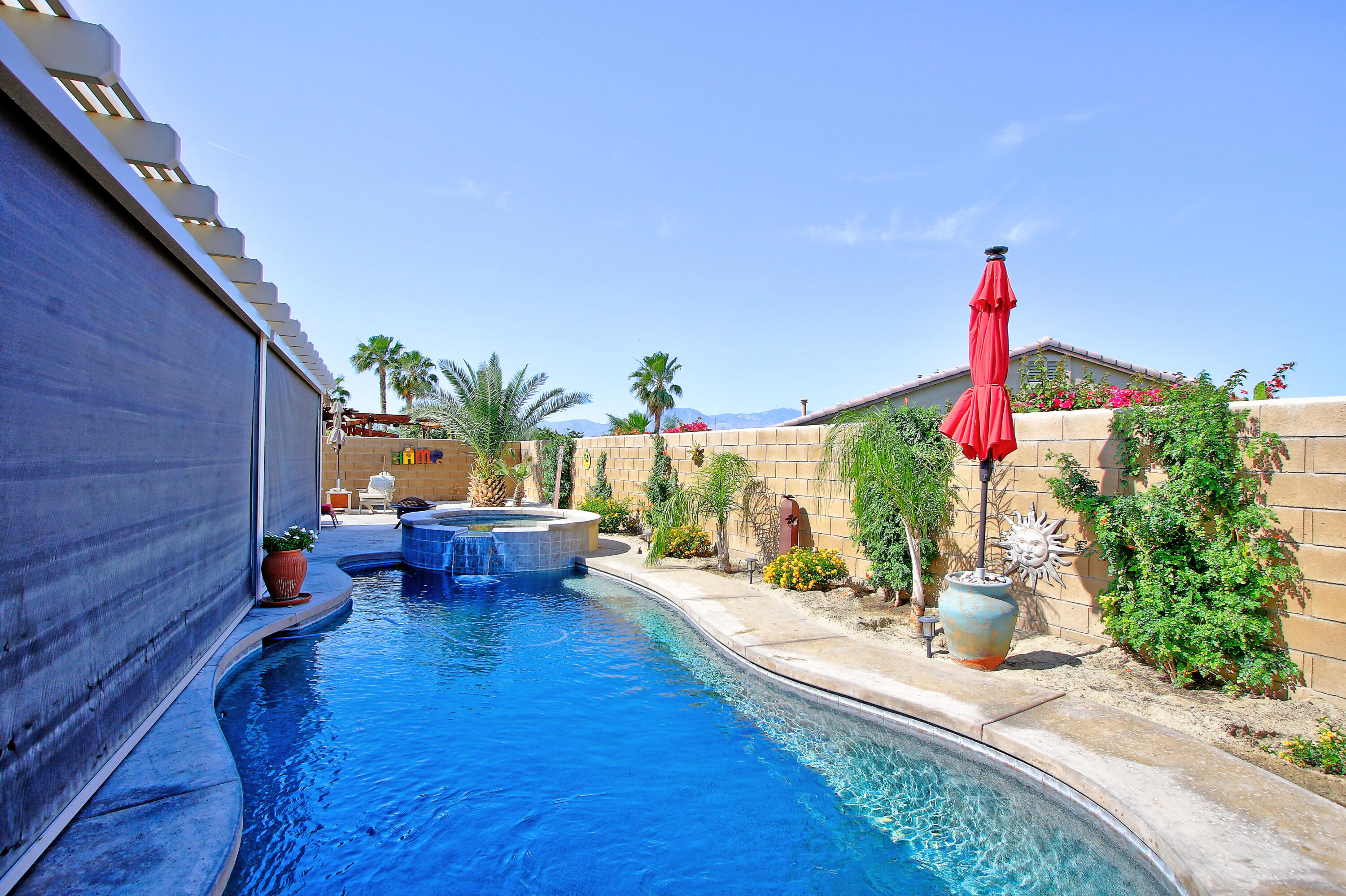 40651 Morris Street Indio, CA 92203 - Photo 37 of 47 a backyard of a house with outdoor seating