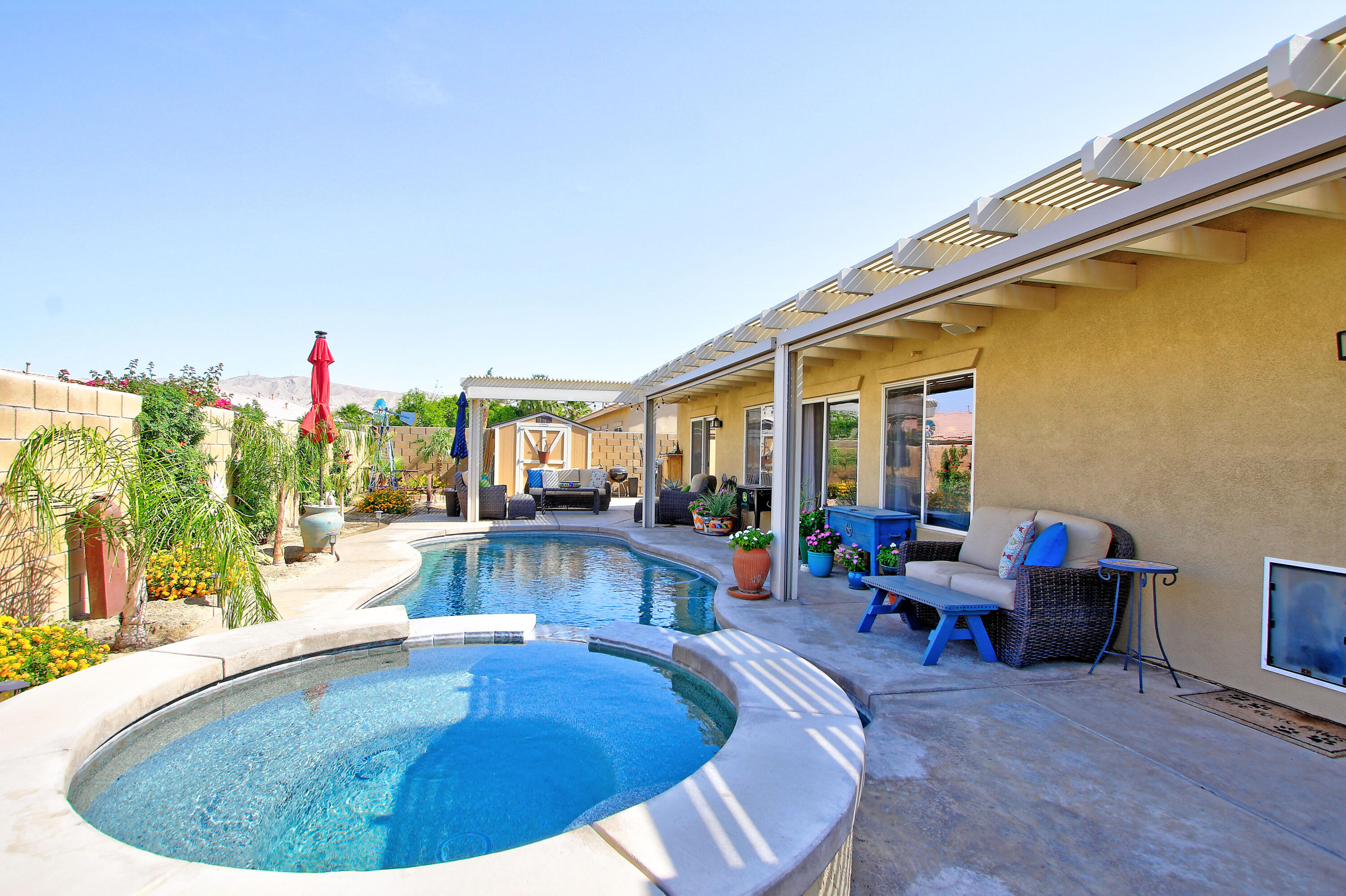 40651 Morris Street Indio, CA 92203 - Photo 38 of 47 a view of a swimming pool with seating area