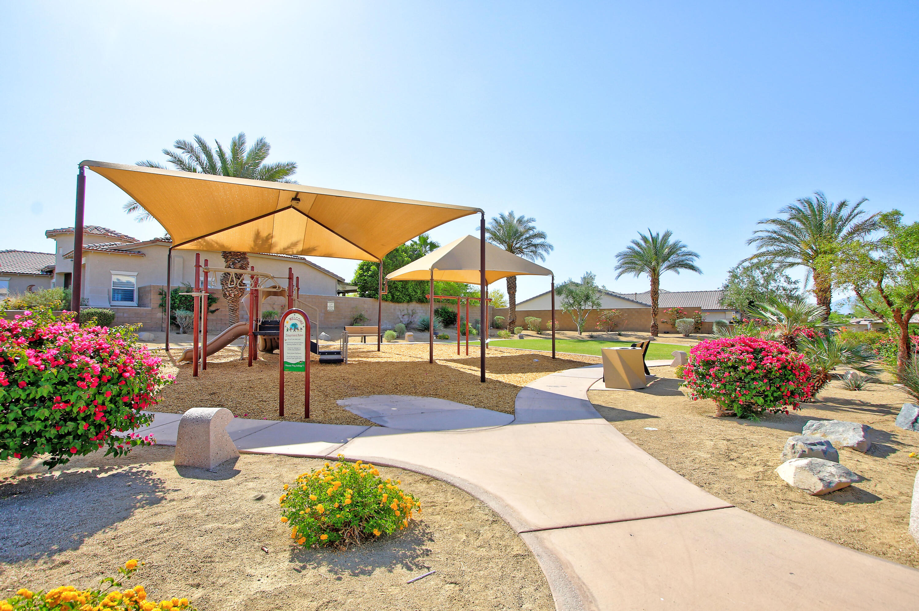 40651 Morris Street Indio, CA 92203 - Photo 46 of 47 a view of a swimming pool with a lounge chair and potted plants