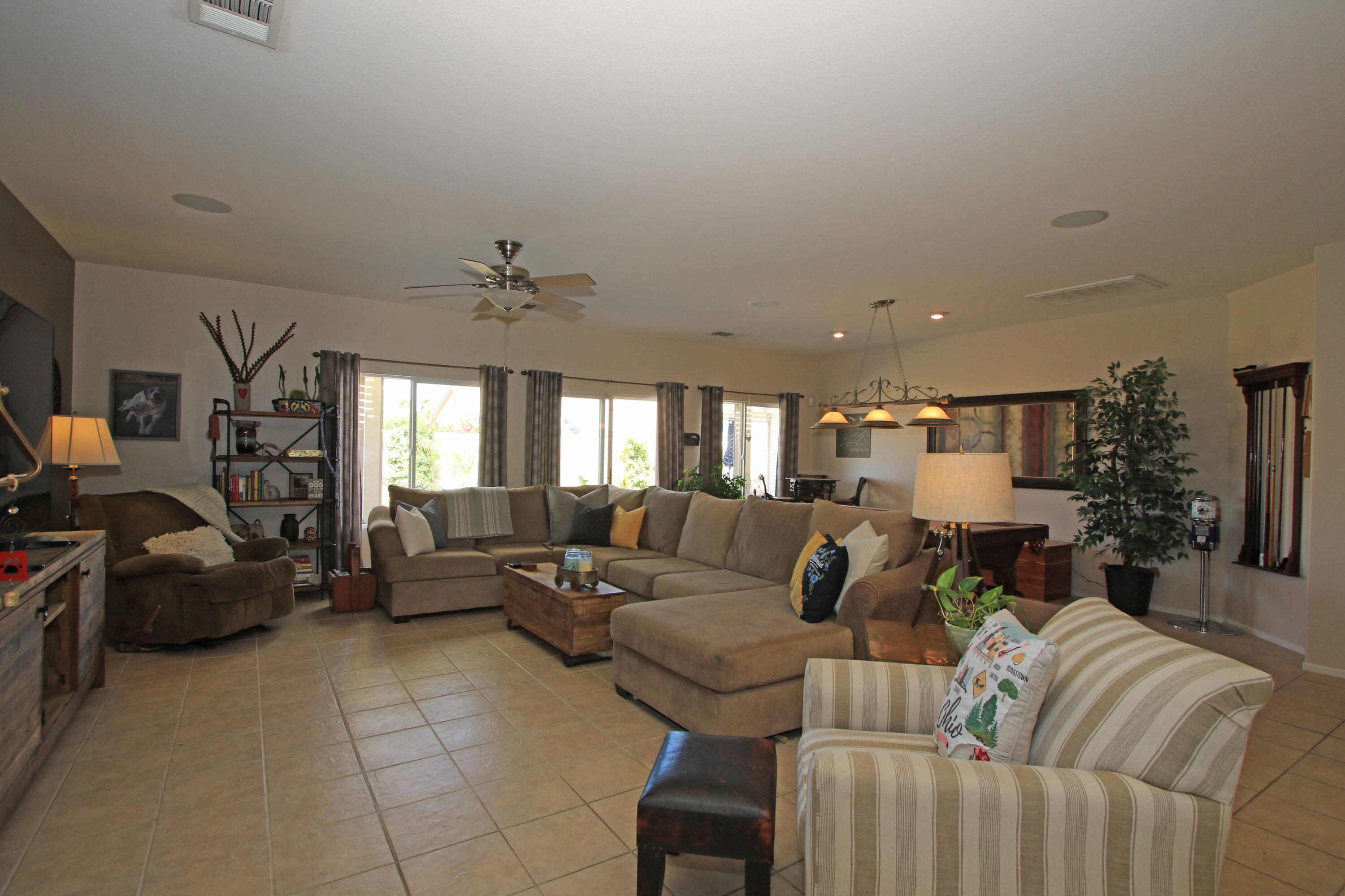 40651 Morris Street Indio, CA 92203 - Photo 6 of 47 a living room with furniture and a chandelier