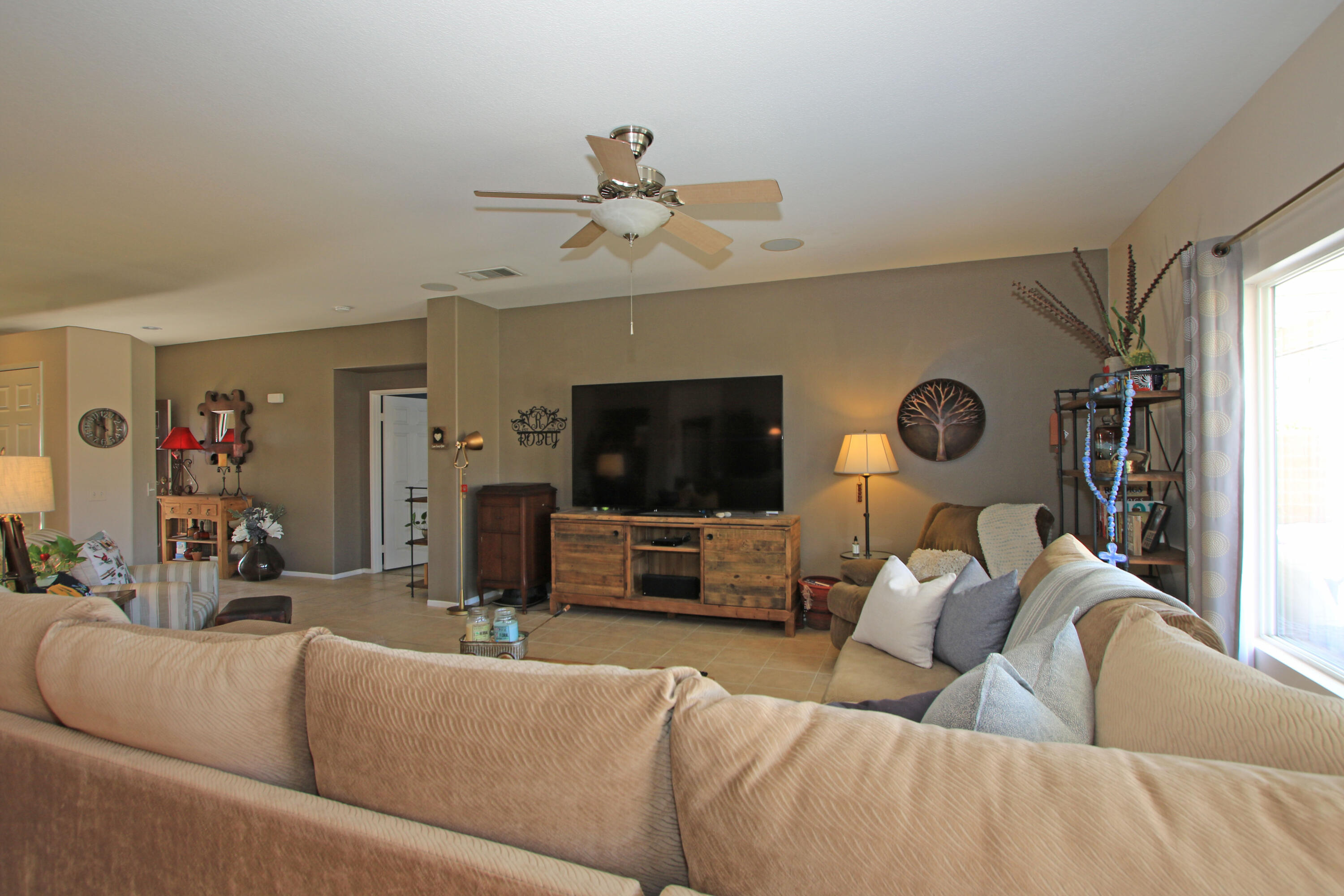 40651 Morris Street Indio, CA 92203 - Photo 8 of 47 a living room with furniture and a flat screen tv