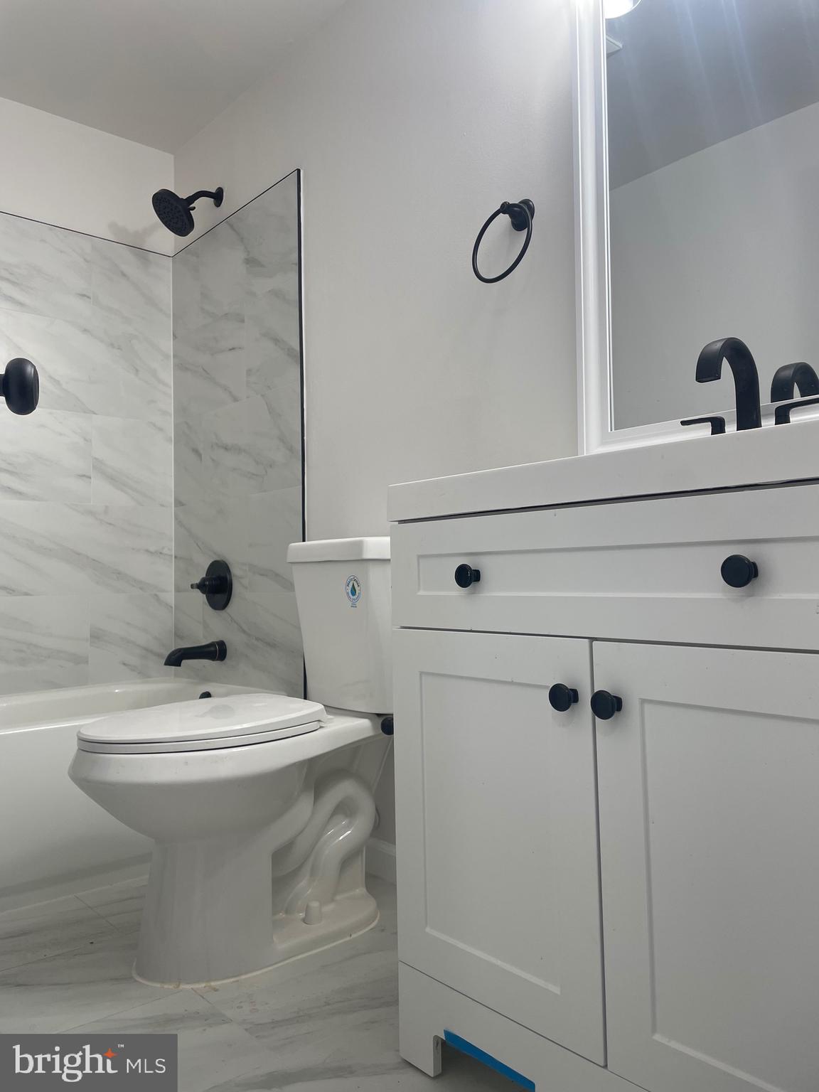 7927 Red Jacket Way Jessup, MD 20794 - Photo 12 of 20 a bathroom with a sink a toilet and shower