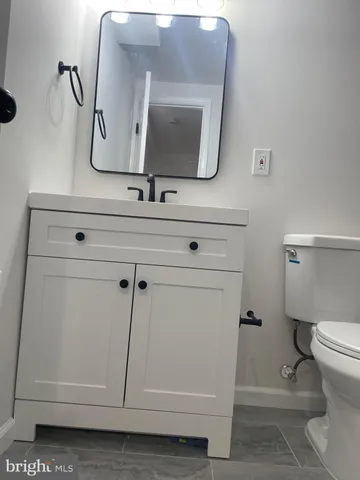 a bathroom with a toilet and a sink