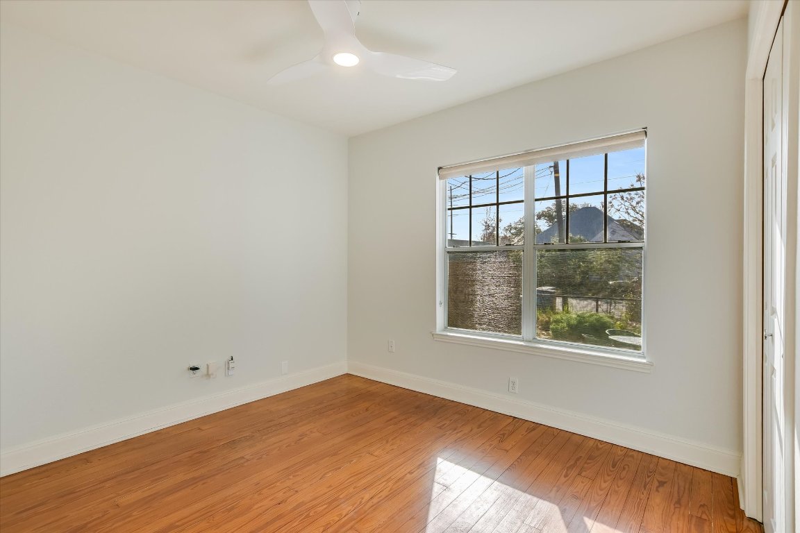 1208 East 13th Street Austin, TX 78702 - Photo 12 of 12 Empty room featuring light wood-type flooring and ceiling fan