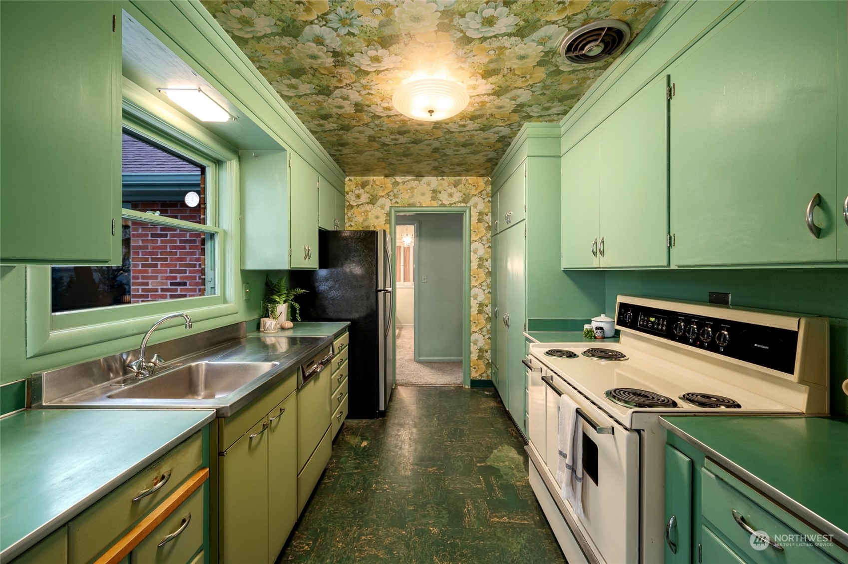 101 Willow Road Bellingham, WA 98225 - Photo 17 of 40 a kitchen with a sink stove and cabinets