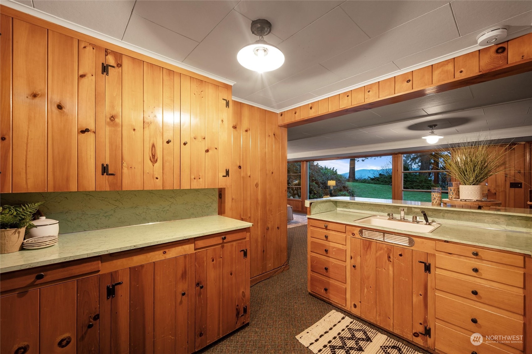 101 Willow Road Bellingham, WA 98225 - Photo 27 of 40 a kitchen with a sink and cabinets