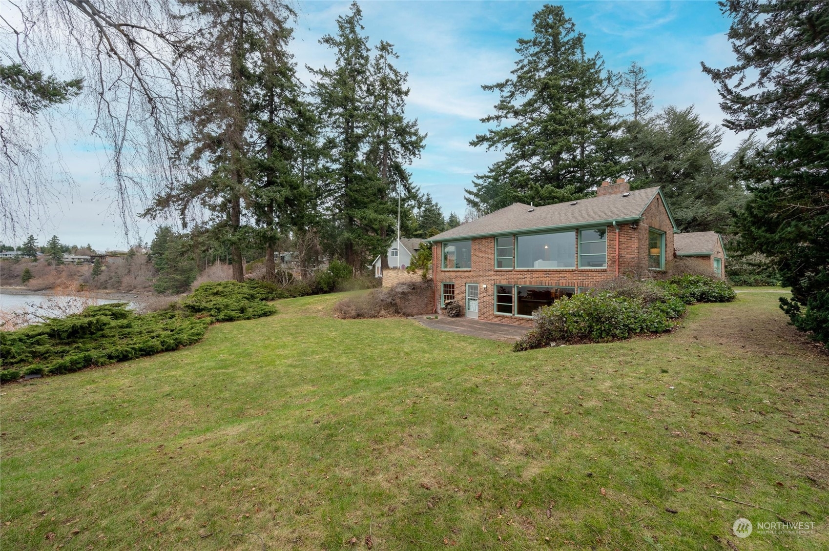 101 Willow Road Bellingham, WA 98225 - Photo 6 of 40 a view of a house with backyard and sitting area