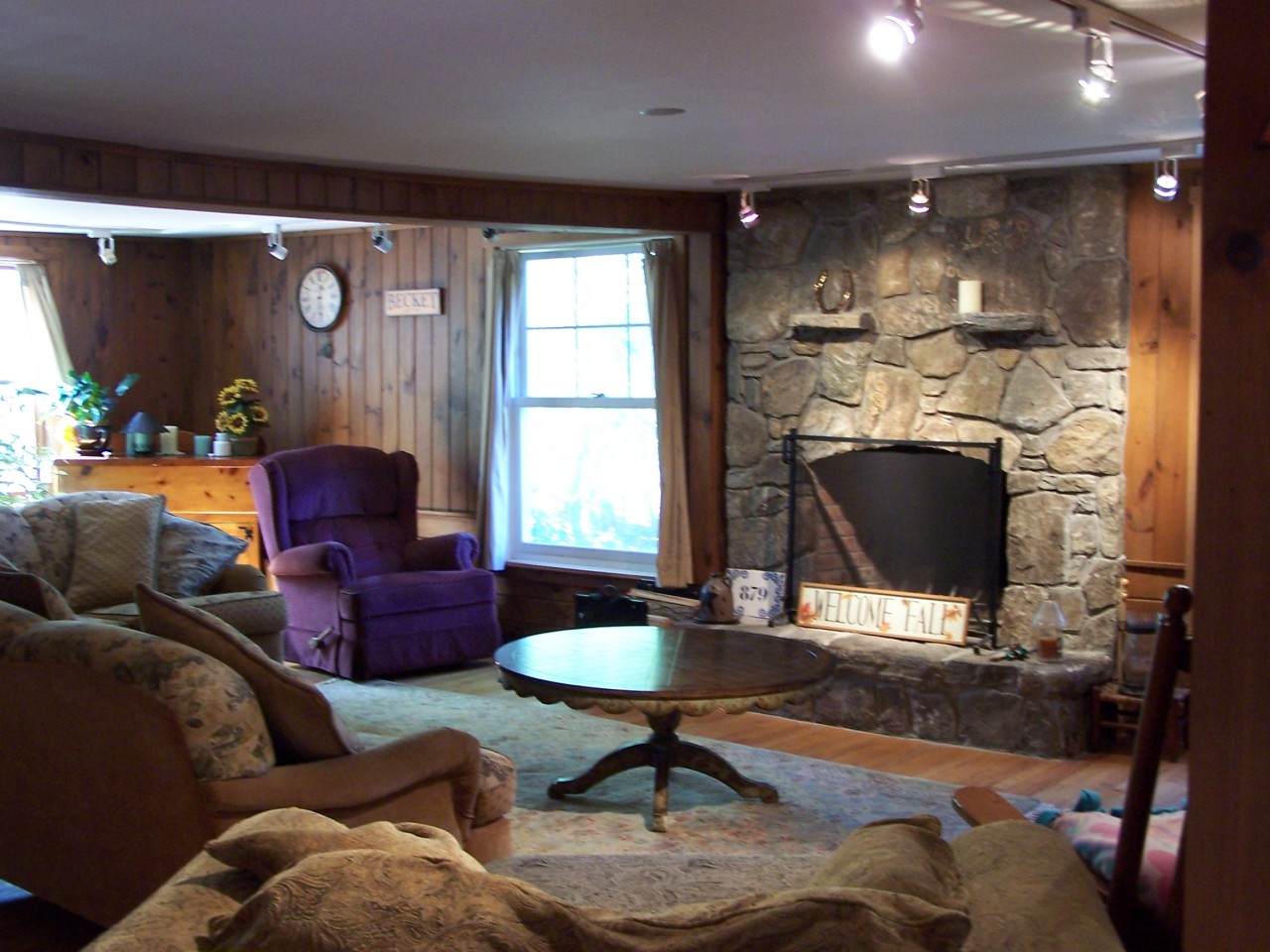 879 Wade Inn Road Becket, MA 01223 - Photo 3 of 29 a living room with furniture and a fireplace