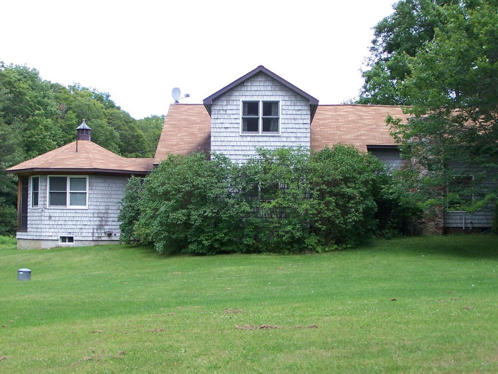 879 Wade Inn Road Becket, MA 01223 - Photo 23 of 29 a view of a house with a yard and a garden