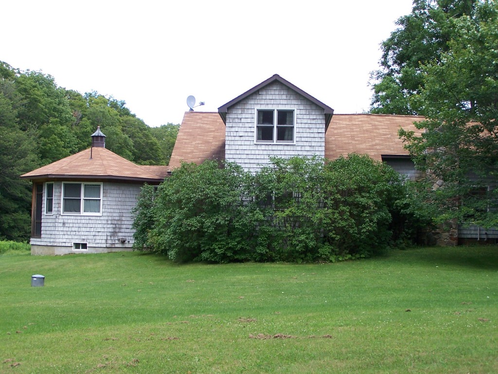 879 Wade Inn Road Becket, MA 01223 - Photo 24 of 29 a front view of a house with a yard