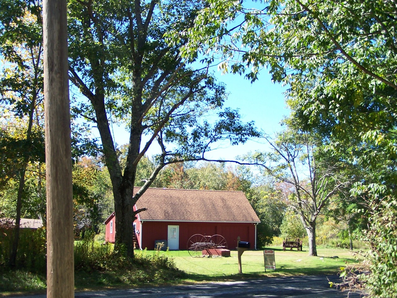 879 Wade Inn Road Becket, MA 01223 - Photo 27 of 29 a front view of a house with garden
