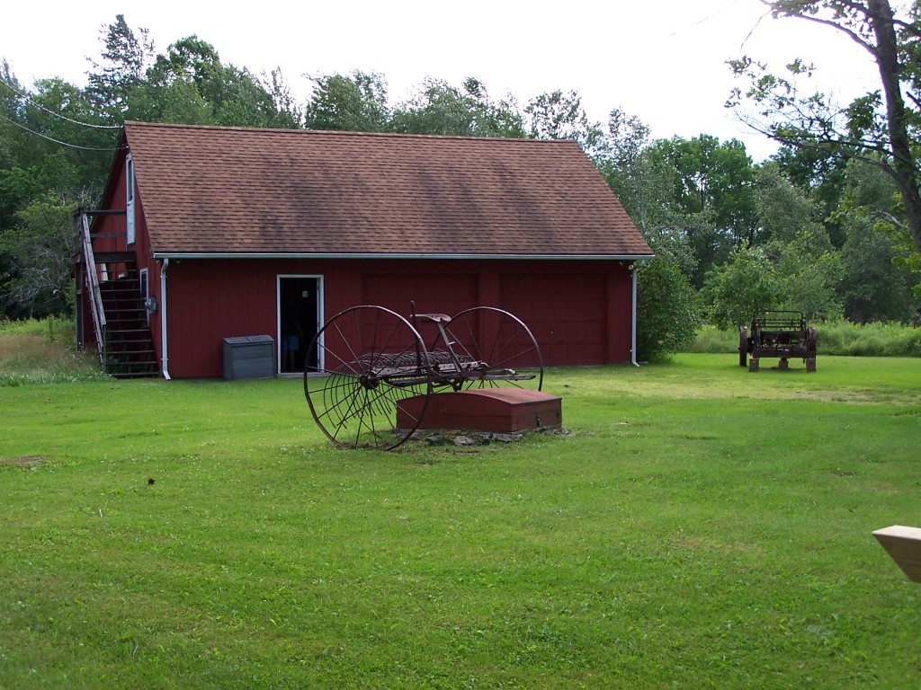 879 Wade Inn Road Becket, MA 01223 - Photo 6 of 29 a view of a barn with big yard and a large tree