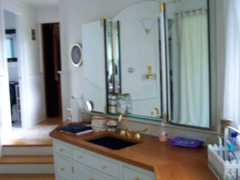 879 Wade Inn Road Becket, MA 01223 - Photo 10 of 29 a bathroom with a granite countertop sink and a mirror