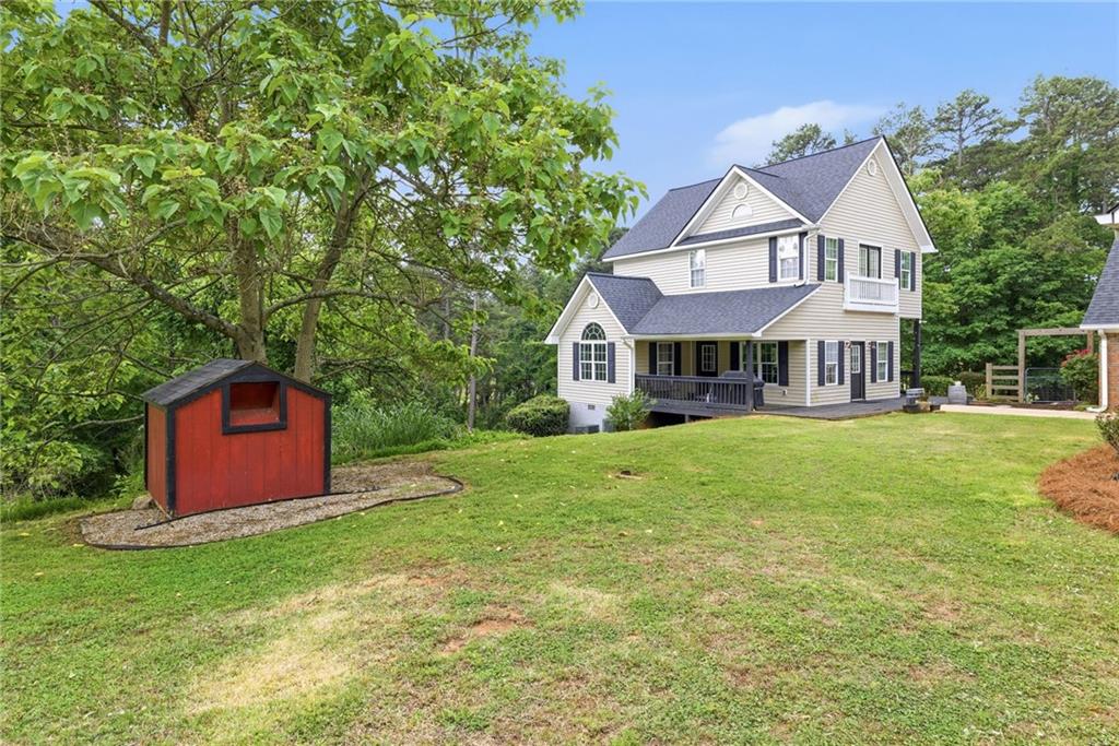 4337 Mountain View Road Oakwood, GA 30566 - Photo 65 of 84 a front view of a house with a garden