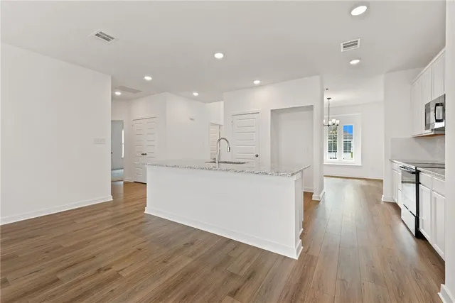 a view of kitchen with wooden floor