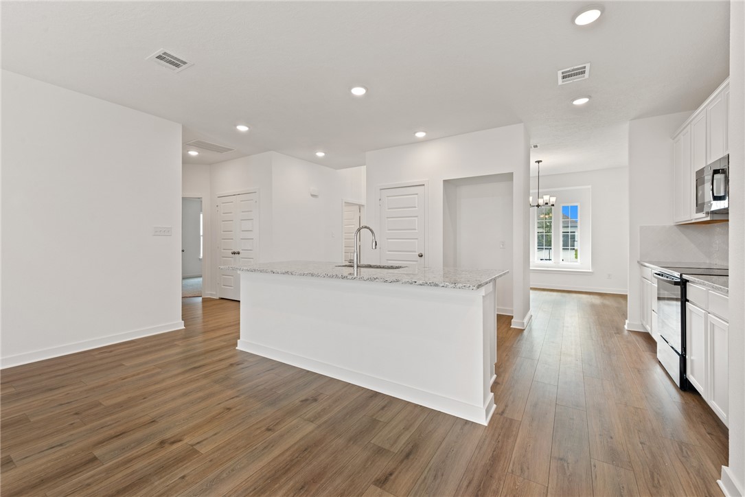 2426 Rooke Road Bryan, TX 77807 - Photo 15 of 39 a view of kitchen with wooden floor