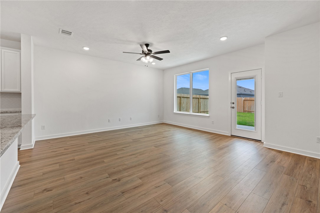 2426 Rooke Road Bryan, TX 77807 - Photo 20 of 39 a view of an empty room with a window and wooden floor