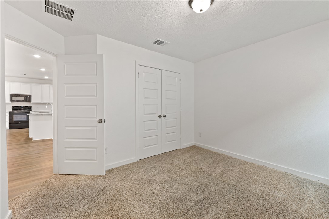 2426 Rooke Road Bryan, TX 77807 - Photo 28 of 39 wooden floor in an empty room