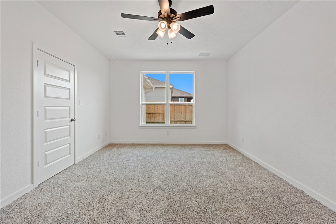 2426 Rooke Road Bryan, TX 77807 - Photo 30 of 39 wooden floor in an empty room with a window