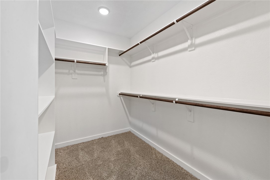 2426 Rooke Road Bryan, TX 77807 - Photo 37 of 39 a view of walk in closet with empty racks