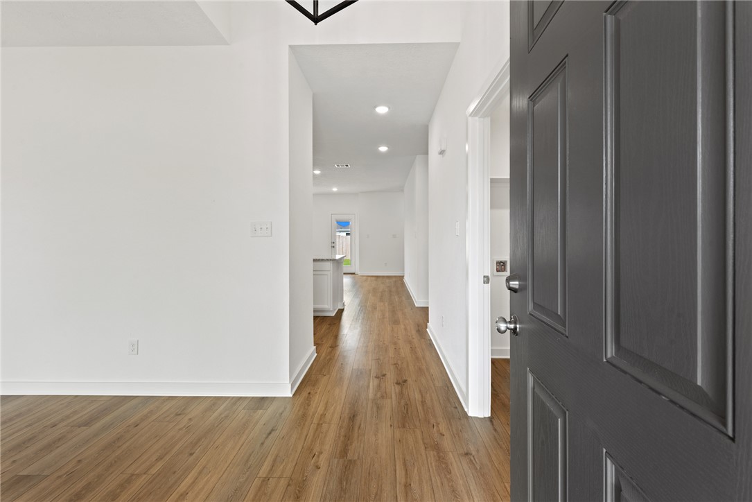 2426 Rooke Road Bryan, TX 77807 - Photo 5 of 39 a view of a hallway with wooden floor