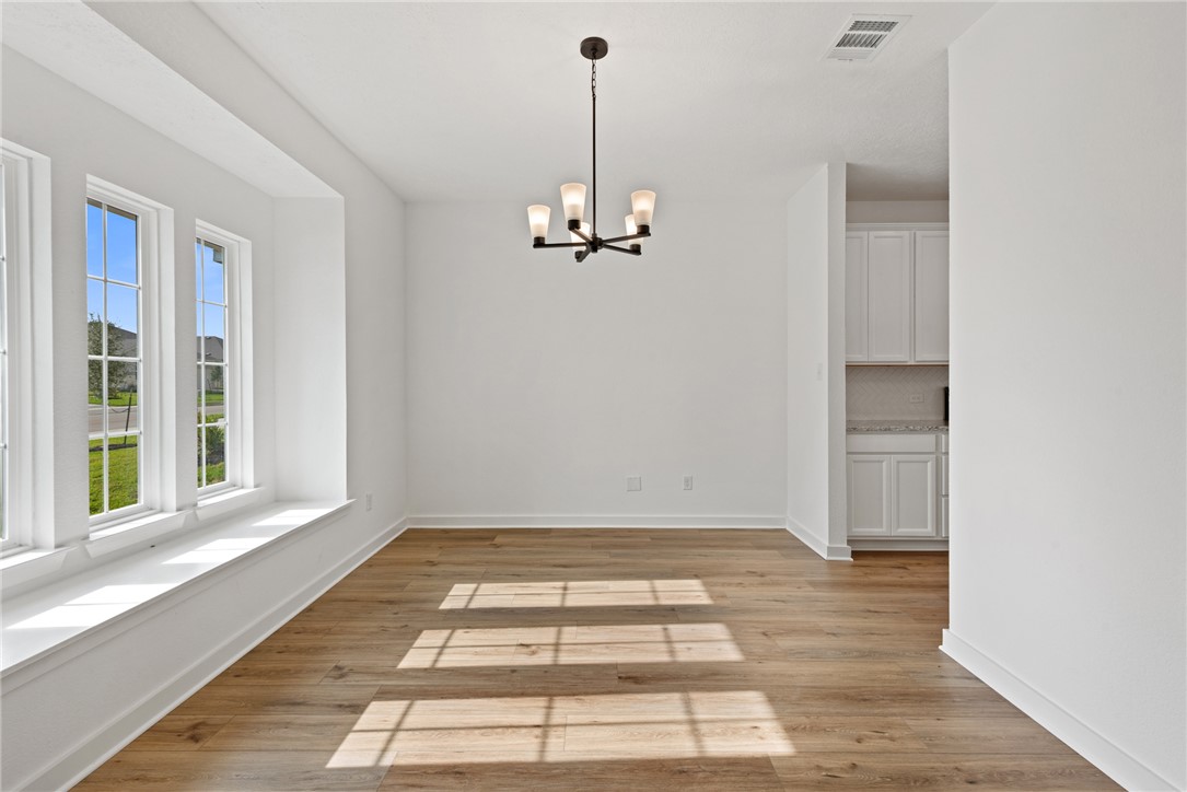 2426 Rooke Road Bryan, TX 77807 - Photo 6 of 39 a view of a room with a window and hardwood floor