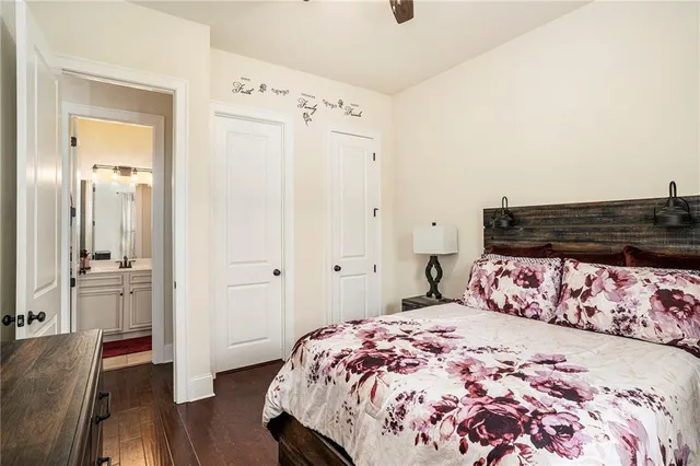 a bathroom with a sink mirror vanity and toilet