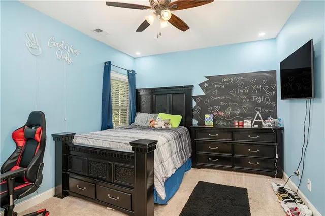 a bedroom with a bed and a cabinet