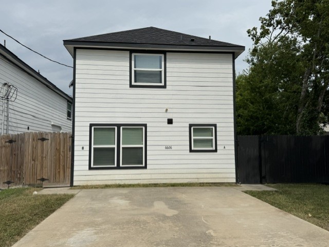 a front view of a house with a garage