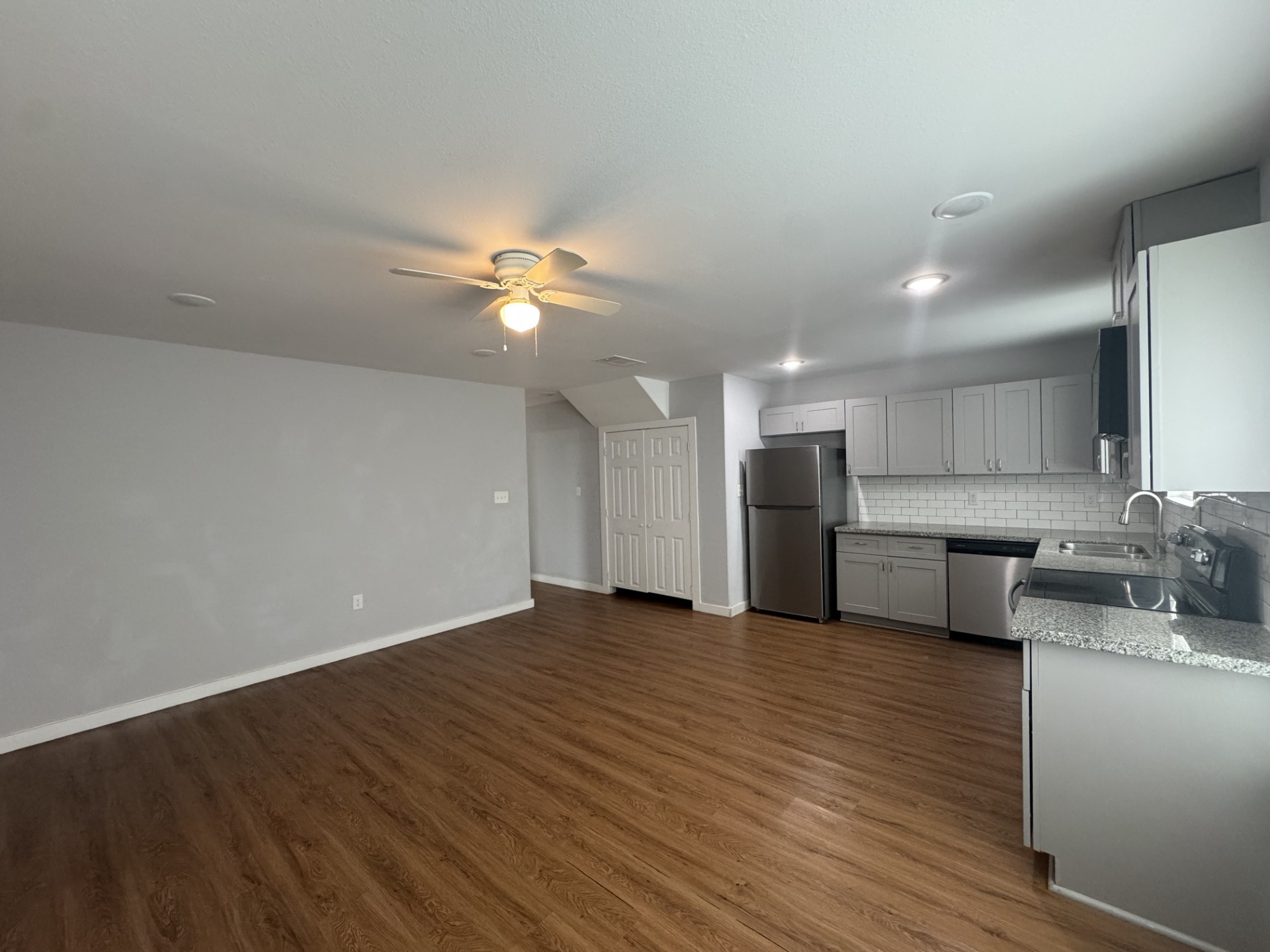 6606 Haight Street Houston, TX 77028 - Photo 14 of 23 a view of a kitchen with a sink a microwave and cabinets