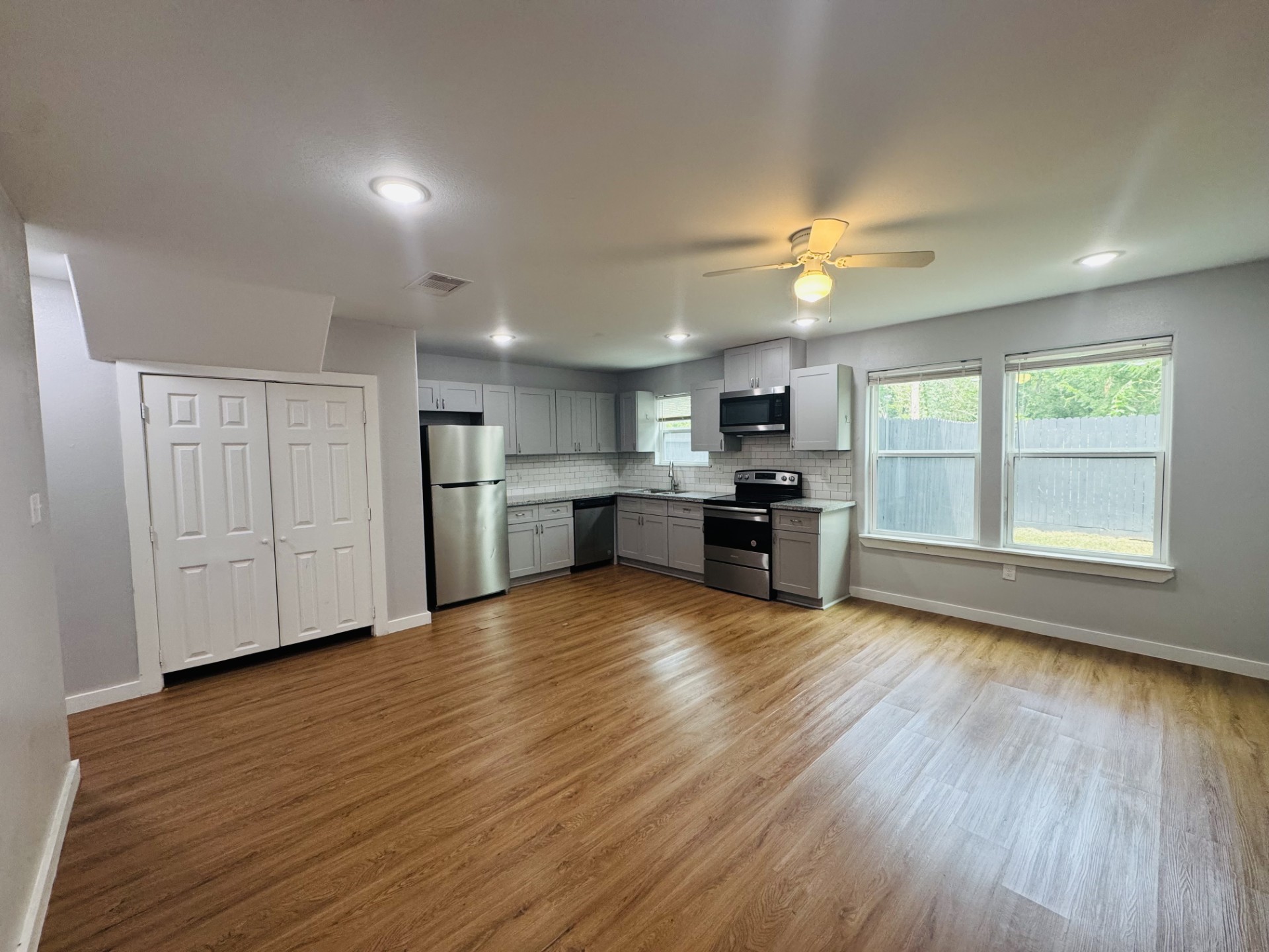 6606 Haight Street Houston, TX 77028 - Photo 3 of 23 a view of kitchen with refrigerator stove and wooden floor